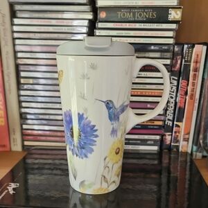 Nature-Inspired Hummingbird Mug with Blue and Yellow Floral Design